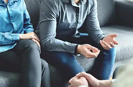 An adoptive couple meeting with a lawyer