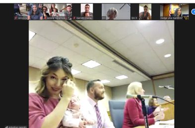 Screenshot of an adoptive family on Zoom at their adoption finalization