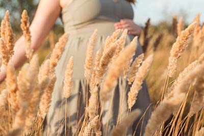pregnant woman in a field in South Dakota