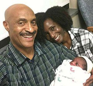<em>New adoptive parents Aaron and Kimberly beam with joy after meeting their son</em>