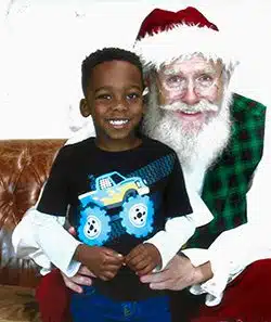 Zachary poses for a portrait on Santa's lap