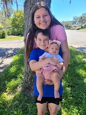 Brittany's kids posing together with smiles