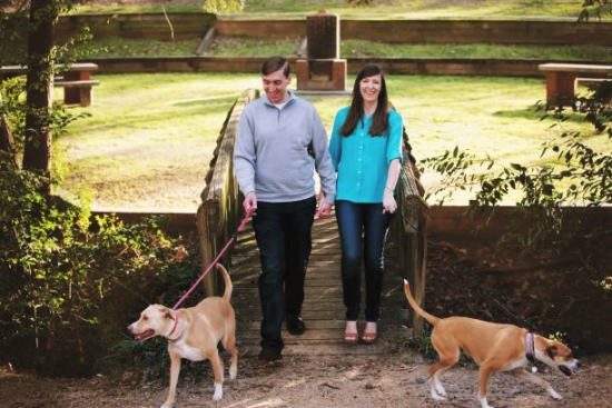 Hopeful adoptive parents Greg and Kerry on a walk with their two dogs