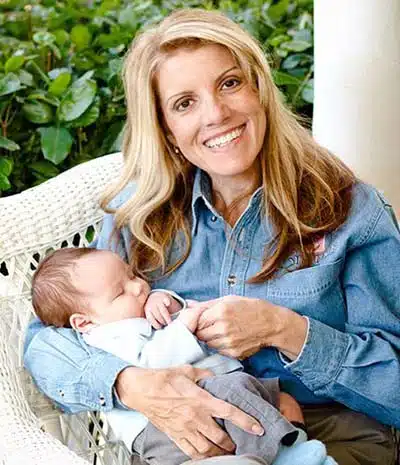 Mardie Caldwell, adoption expert, holding baby