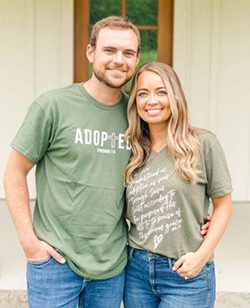 Hopeful adoptive parents Isaac and Taelor in adoption shirts