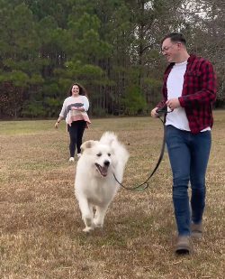 Hopeful adoptive parents Jacob and Blake play with their dog at a park