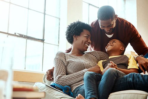 Family of three having fun at home