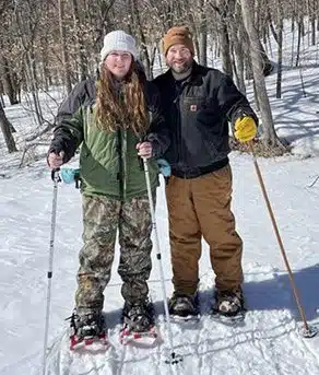Wittne and Scott pause during a cross-country skiing trip