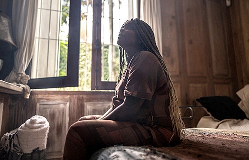 Pregnant woman thinking at home
