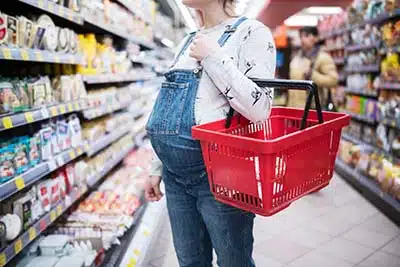 pregnant woman shopping for food