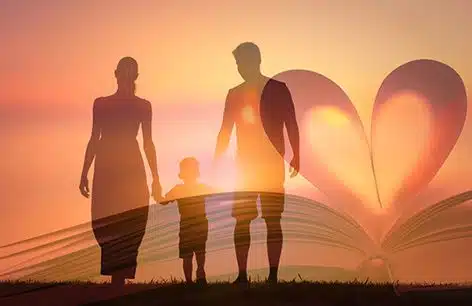 Family walking at sunset with a superimposed image of an open Bible 