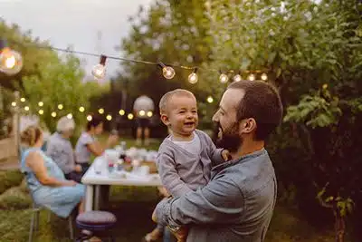 Father and son having fun at an adoption party