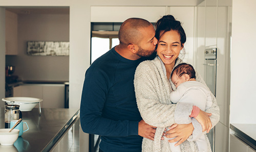 Happy couple enjoying maternity leave for adoptive parents 