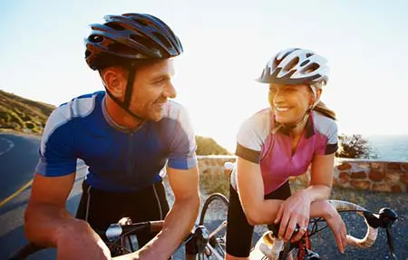 man and woman riding bikes