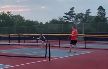 Laura and Al enjoy a game of doubles tennis