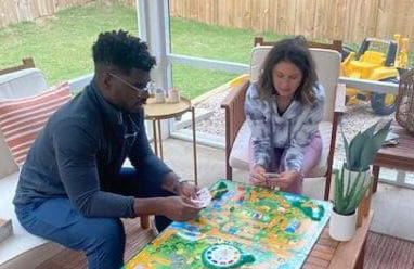 James and Lauren playing a game in their three seasons room 