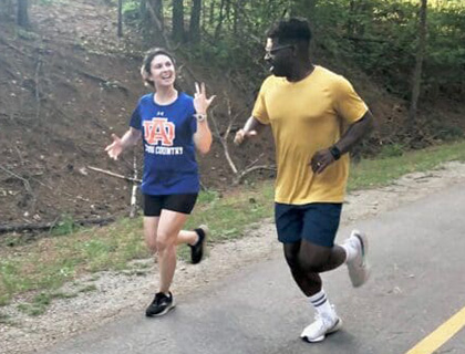 Lauren and James chatting with each other as they run