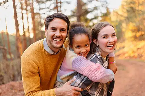Happy adoptive family on a hike