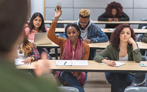 A multi-ethnic group of high school students in sex ed class