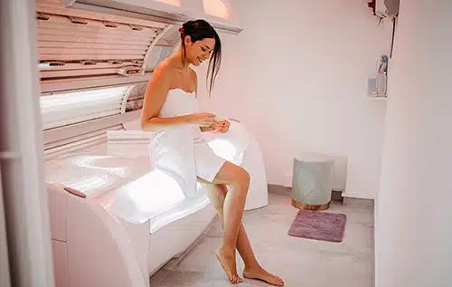 Beautiful woman getting ready to go in a tanning bed