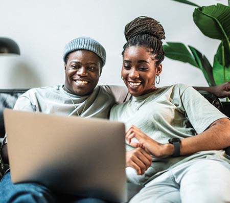 Couple looking at laptop reading about Florida adoption laws