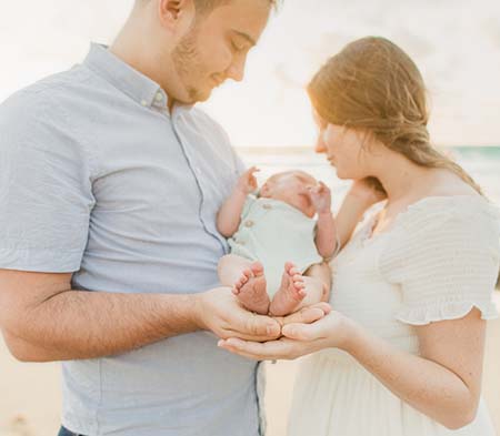 couple with baby on Florida beach