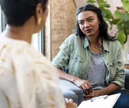 woman in session with grief counselor