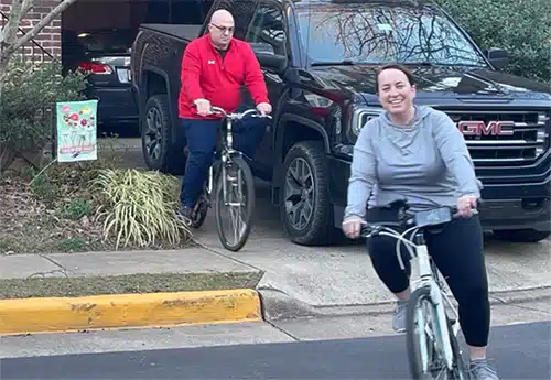 Bert and Jamie leaving their home for a bike ride together