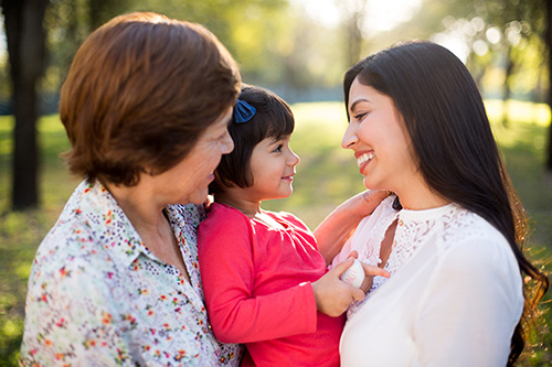 Happy adoptive mother and daughter visit at a park on Birth Mother's Day