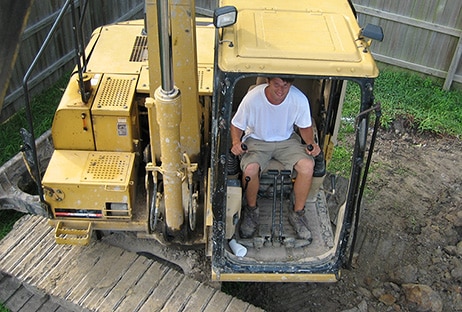 Bob moving soil in their backyard