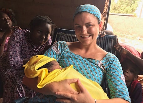 Hopeful adoptive mother Abby holding the baby named after her