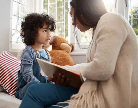 mom reading an adoption book for kids