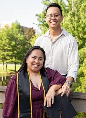 Rachelle poses with her husband Trung after obtaining her nursing degree