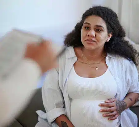 pregnant-woman-talking-to-professional