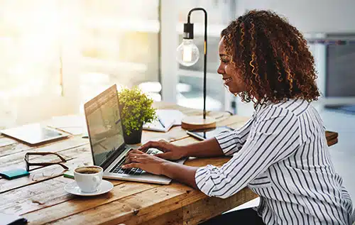 Hopeful adoptive mother using her laptop to blog