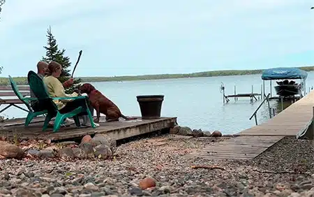 Chad and Taylor enjoy time at the lake with their dog