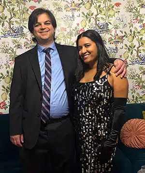 Adoptive parents Mark and Genesis dressed up to attend a special event