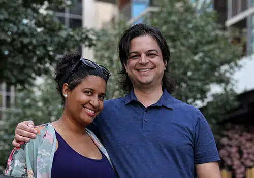 Genesis and Mark, who are hoping to adopt their second child, pose for the camera outdoors
