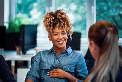 pregnant woman getting advice from a finance counselor on the cost of raising a baby
